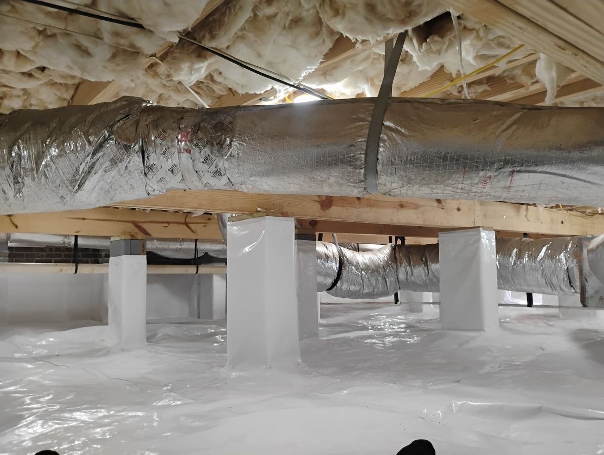JHS crawl space waterproofing job photo showing crawl space moisture conditions