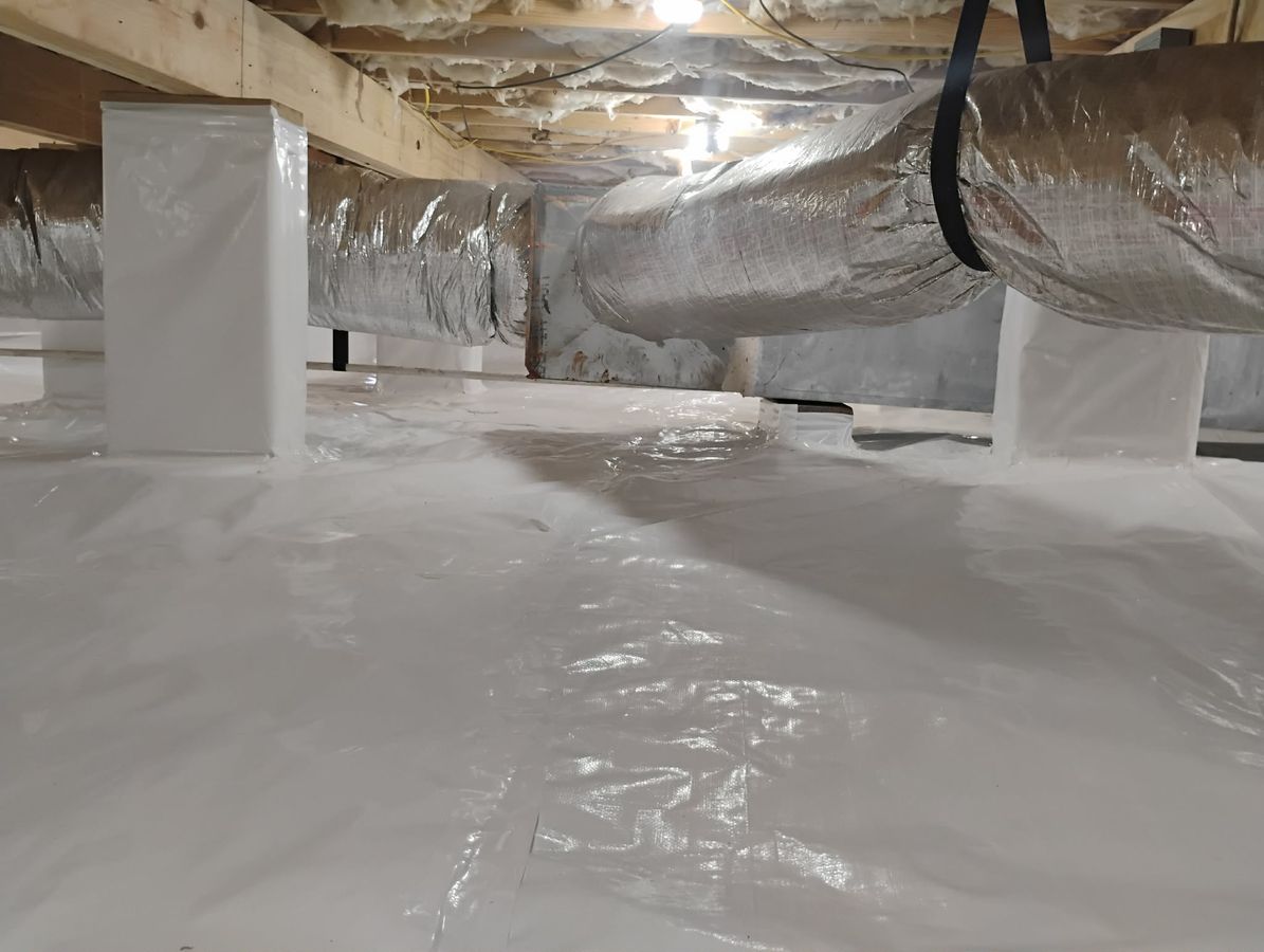 JHS crawl space waterproofing job photo showing site preparation under a home